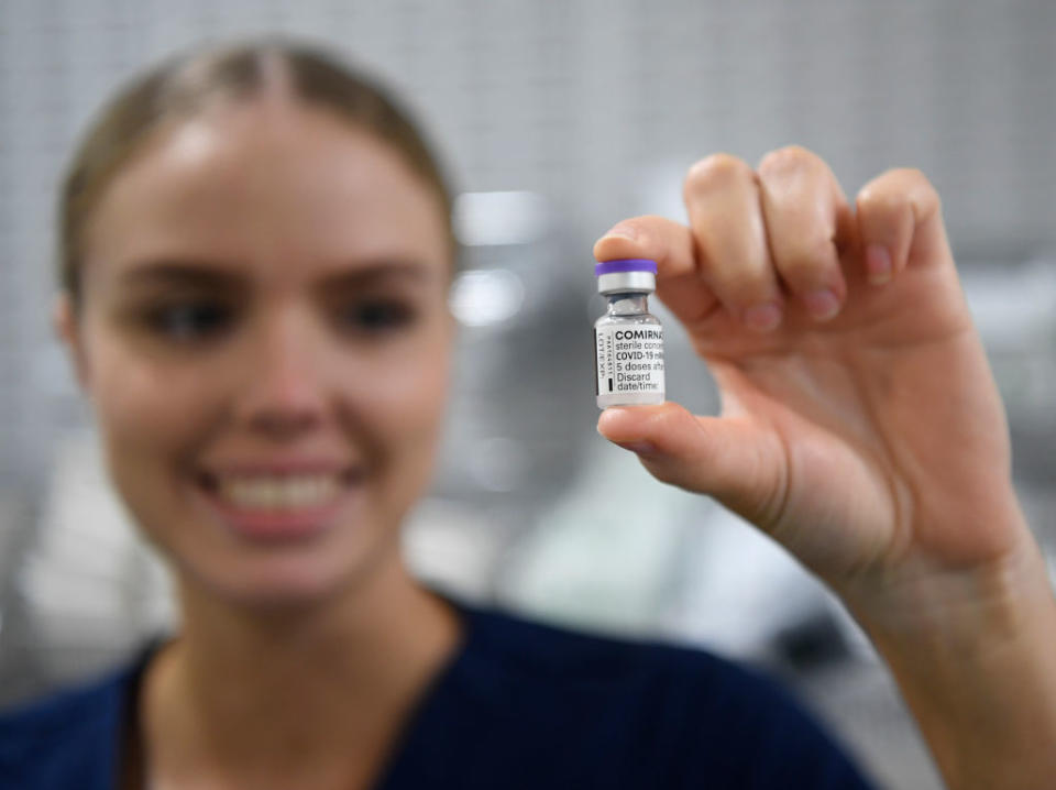 Registered Nurse (RN) Christina O'Donnell holds a vial of the Pfizer COVID-19 vaccine at Townsville University Hospital in Townsville, Australia. 