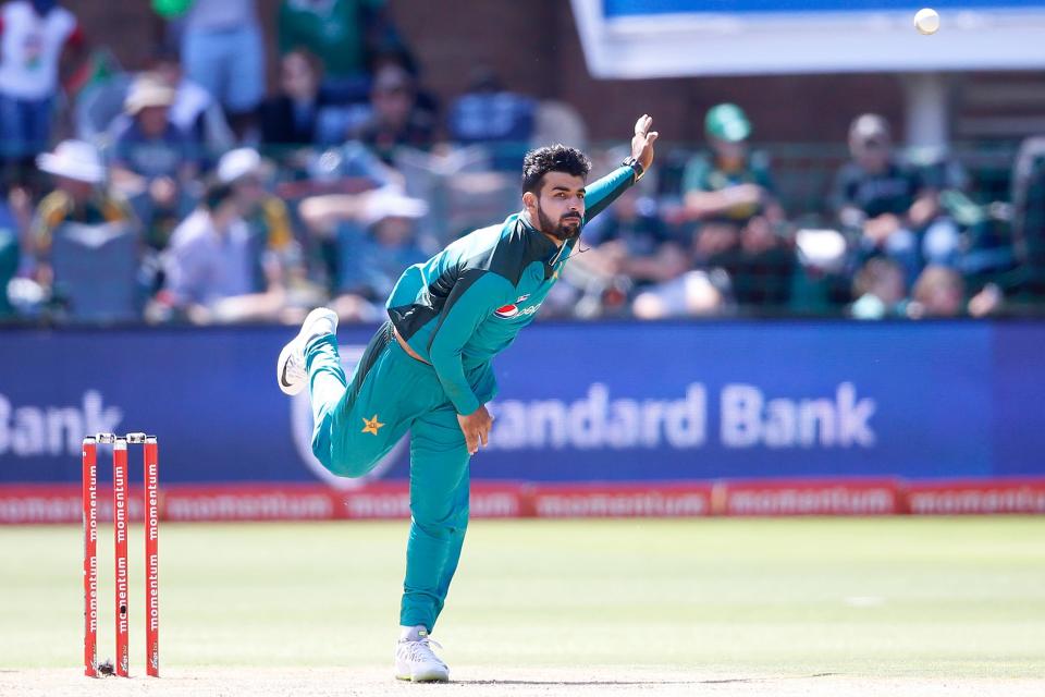 Pakistan bowler Shadab Khan bowls on South African batsman Reeza Hendricks (not in picture) (Photo by GIANLUIGI GUERCIA / AFP)