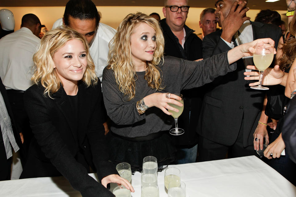 There's nothing extra special about their outfits, but isn't it weird how not weird Mary-Kate and Ashley look surrounded by a zillion drinks?