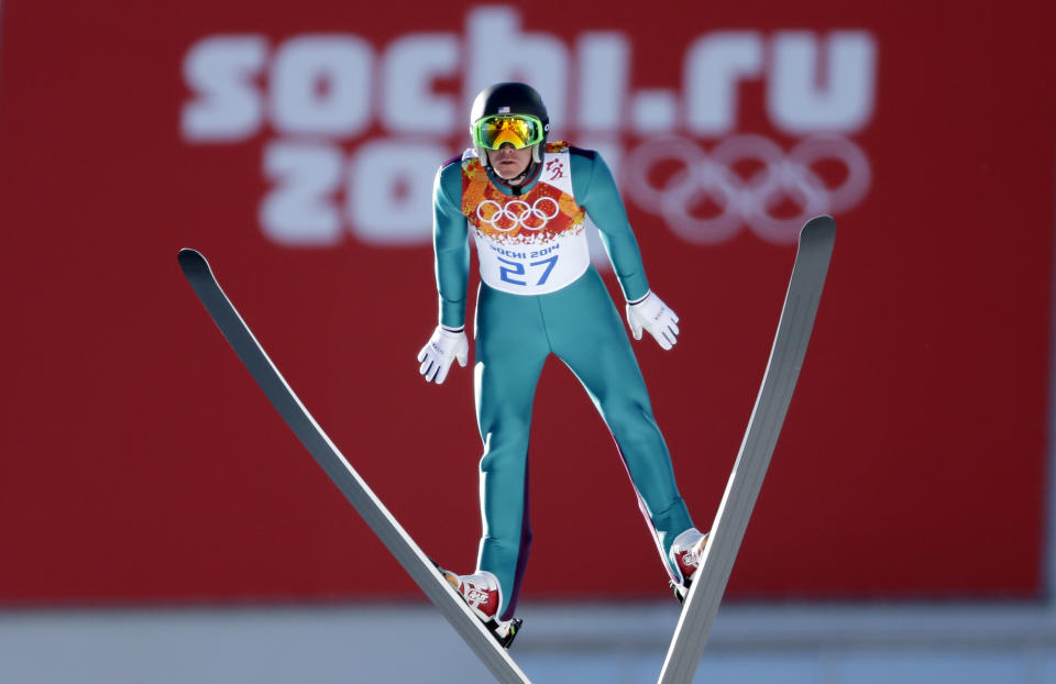 United States' Bill Demong makes his trial jump during the ski jumping portion of the Nordic combined at the 2014 Winter Olympics, Wednesday, Feb. 12, 2014, in Krasnaya Polyana, Russia. (AP Photo/Matthias Schrader)
