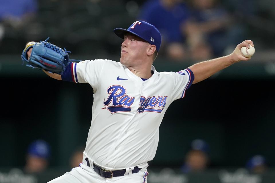 Texas Rangers relief pitcher Kolby Allard throws to the Kansas City Royals in the third inning of a baseball game, Wednesday, May 11, 2022, in Arlington, Texas. (AP Photo/Tony Gutierrez)