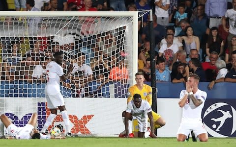 England players appear dejected after Aaron Wan Bissaka (centre, floor) scores an own goal during the UEFA European Under-21 Championship, Group C match at Dino Manuzzi - Credit: PA