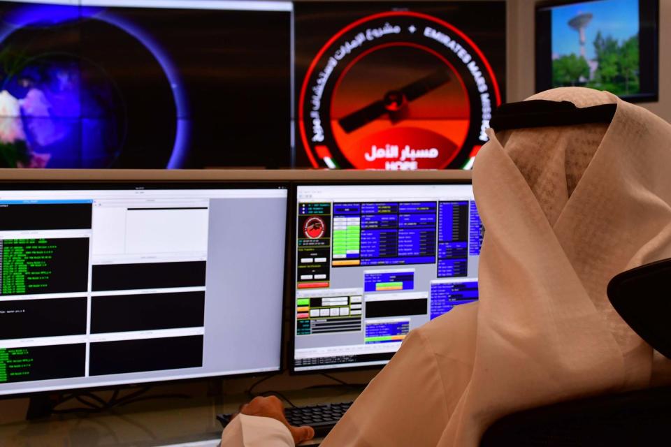 An employee works at the control room of the Mars Mission at the Mohammed Bin Rashid Space Centre, Dubai (AFP via Getty Images)