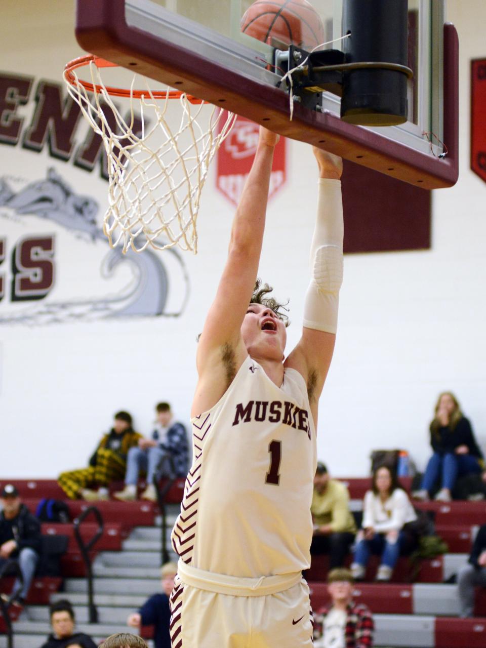 Nathan Walker scores from the block during double overtime during John Glenn's 93-82 win against visiting River View on Tuesday night in New Concord. Walker had a team-high 28 points.