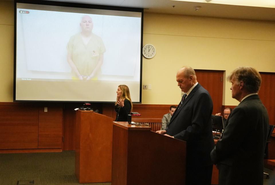 Former Columbus police K-9 officer Ricky Anderson appeared Aug. 7, 2023, in Franklin County Common Pleas Court by video from the jail during his arraignment on murder and reckless homicide charges in the shooting death of Donovan Lewis. In the courtroom is one of his defense attorneys, Kaitlyn Stephens.
