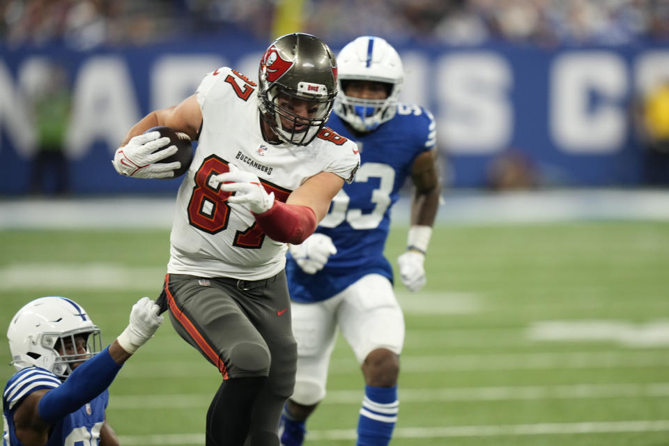 Tampa Bay Buccaneers' Rob Gronkowski (87) runs out of a tackle by Indianapolis Colts' George Odum (30) during the second half of an NFL football game, Sunday, Nov. 28, 2021, in Indianapolis. (AP Photo/AJ Mast)