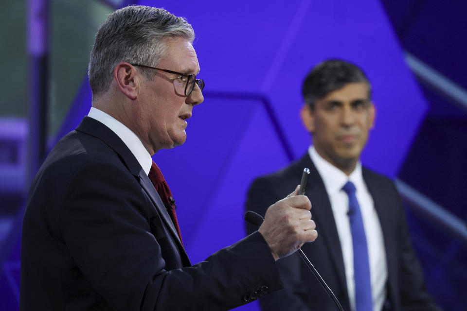 Britain's Prime Minister Rishi Sunak and opposition Labour Party leader Keir Starmer, left, take part for the BBC's Prime Ministerial Debate, in Nottingham, England, Wednesday June 26, 2024. (Phil Noble/Pool via AP)