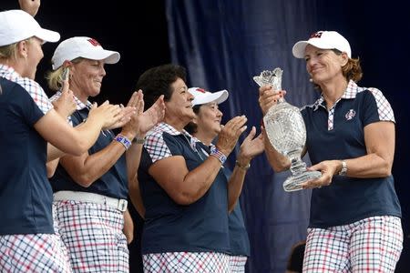 Aug 20, 2017; West Des Moines, IA, USA; Juli Inkster holds the Solheim Cup during the closing ceremony of The Solheim Cup international golf tournament at Des Moines Golf and Country Club. Thomas J. Russo-USA TODAY Sports