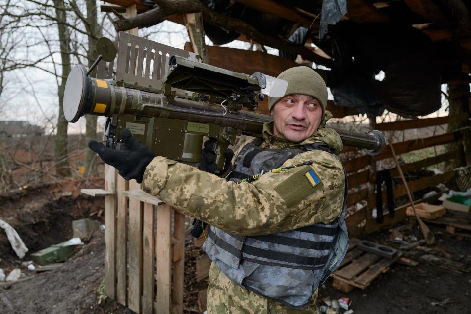 A Ukrainian soldier holds up a US made Stinger