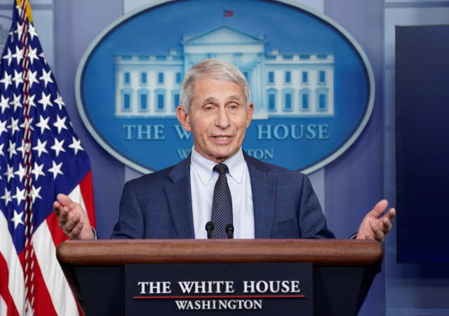 Dr. Anthony Fauci stands at a podium as he speaks about the Omicron coronavirus variant during a press briefing at the White House.