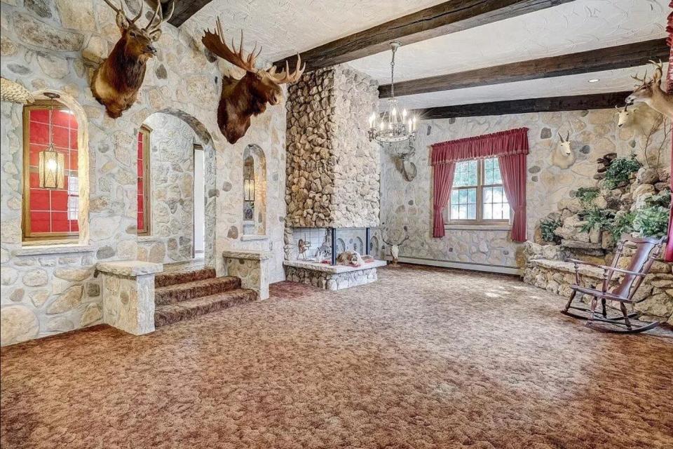 This Hartland "castle" has an extravagant interior to match its royal exterior, including taxidermy animals, stonework and plush carpet.