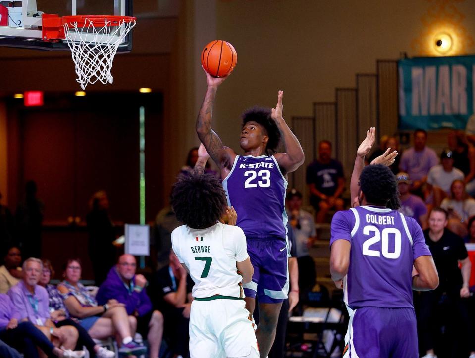 Kansas State freshman forward Macaleab Rich shoots over Miami's Kyshawn George (7) during Sunday's final of the Baha Harm Hoops Championship in Nassau, Bahamas.