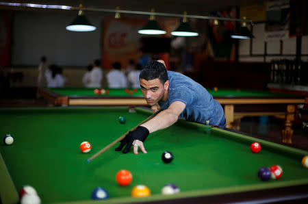 A Palestinian man plays billiards at a club in Gaza City. REUTERS/Suhaib Salem