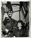 <span>Public Relations photo of Moire Fee and Flight Lieutenant Cote taken in the interior of one of the 6 Group Bombers in 1944. The photo was meant to appear in a Canadian newspaper but was rejected by the censor because it shows the plane's control panel. Photo courtesy of <a href="http://www.thememoryproject.com/stories/1749:moire-fee/" rel="nofollow noopener" target="_blank" data-ylk="slk:Historica-Dominion Institute;elm:context_link;itc:0;sec:content-canvas" class="link ">Historica-Dominion Institute</a>.</span>