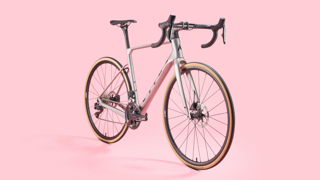  Vitus Venon Evo 105 Di2 road bike on a pink background 