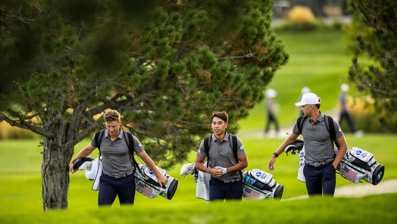 BYU players walk up a fairway during photo day prior to the 2022-23 season.