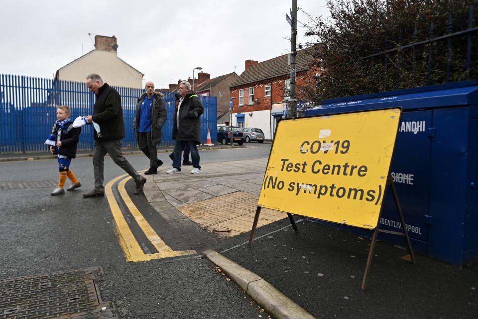 A sign for a temporary Covid-19 testing centre is pictured outside Goodison Park stadium in Liverpool, north west England on January 2, 2022, ahead of the English Premier League football match between Everton and Brighton and Hove Albion. (Photo by Paul ELLIS / AFP) (Photo by PAUL ELLIS/AFP via Getty Images)