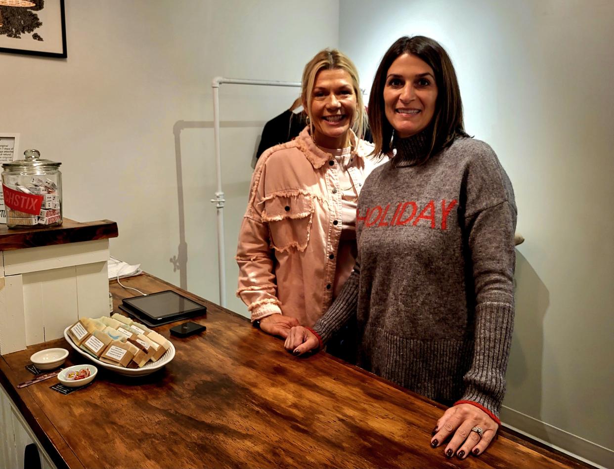 Amy Kent and Ann Marie Oldford at Amunni Boutique in St. Clair stand behind the counter on Friday, Nov. 17, 2023, at Riverview Plaza. Like other business leaders, they're hoping residents shop local this holiday season.
