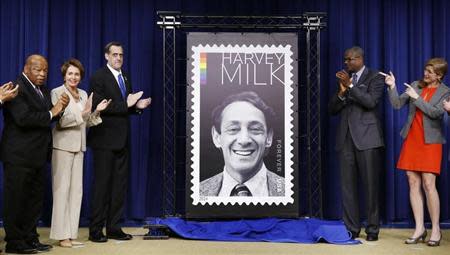 Representative John Lewis (Ga), House Minority Leader Nancy Pelosi, President of the Harvey Milk Foundation Stuart Milk, Deputy Postmaster General Ronald Stroman, and U.S. Ambassador to the UN Samantha Power (L to R) gesture as they unveil the Harvey Milk Forever Stamp at its dedication ceremony at the White House in Washington May 22, 2014. REUTERS/Larry Downing