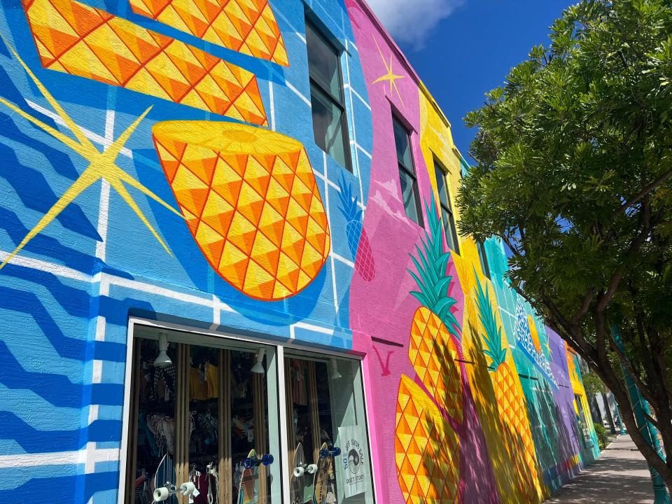 Atlantic Avenue's vibrant pineapple mural on on NE 2nd Ave. was redone this spring by South Florida graffiti artist Marcus “Grabster” Borges.