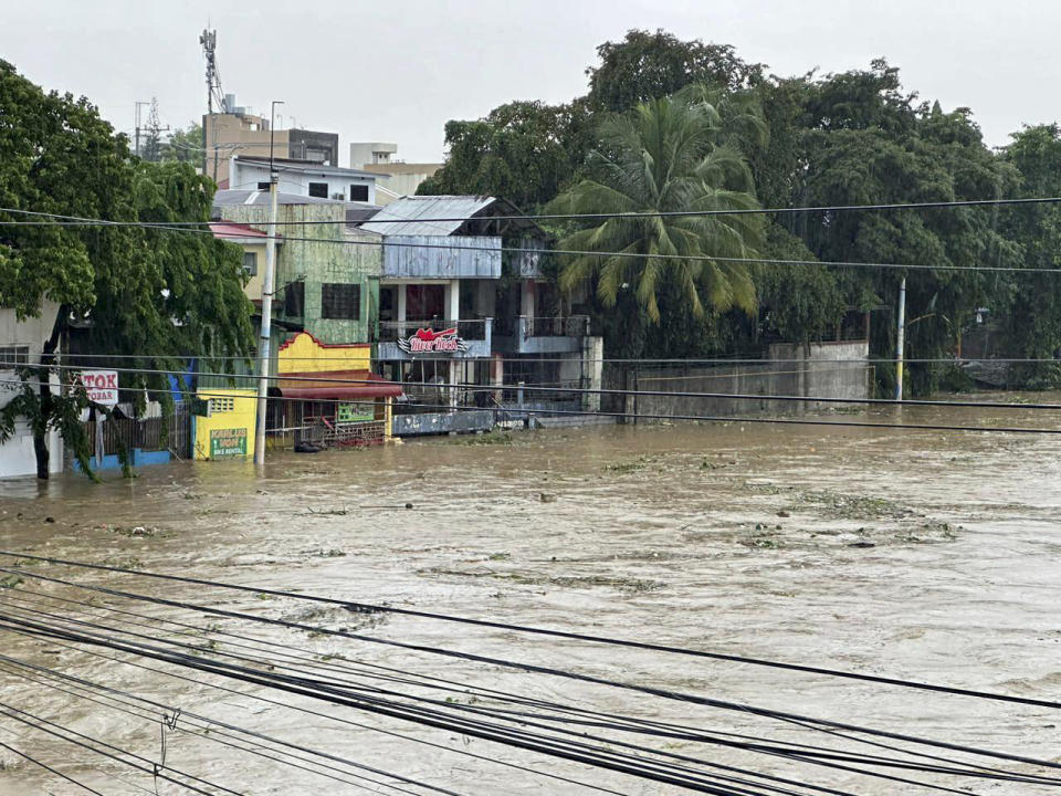 Marikina River swells as monsoon rains worsened by offshore typhoon Gaemi on Wednesday, July 24, 2024, in Manila, Philippines. (AP Photo/Joeal Capulitan)