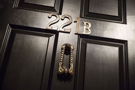 The door bearing the number 221B, is shown from a Sherlock Holmes-themed escape room in Alexandria, Virginia October 17, 2015. REUTERS/Joshua Roberts