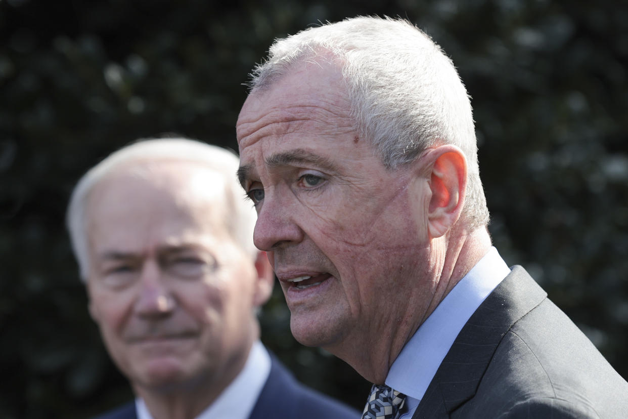 Phil Murphy, right, and Asa Hutchinson (L) (R-AR), Chairman of the National Governors Association, speak outside the White House after a meeting with U.S. President Joe Biden and members of the National Governors Association on January 31, 2022 in Washington, DC. (Win McNamee/Getty Images)
