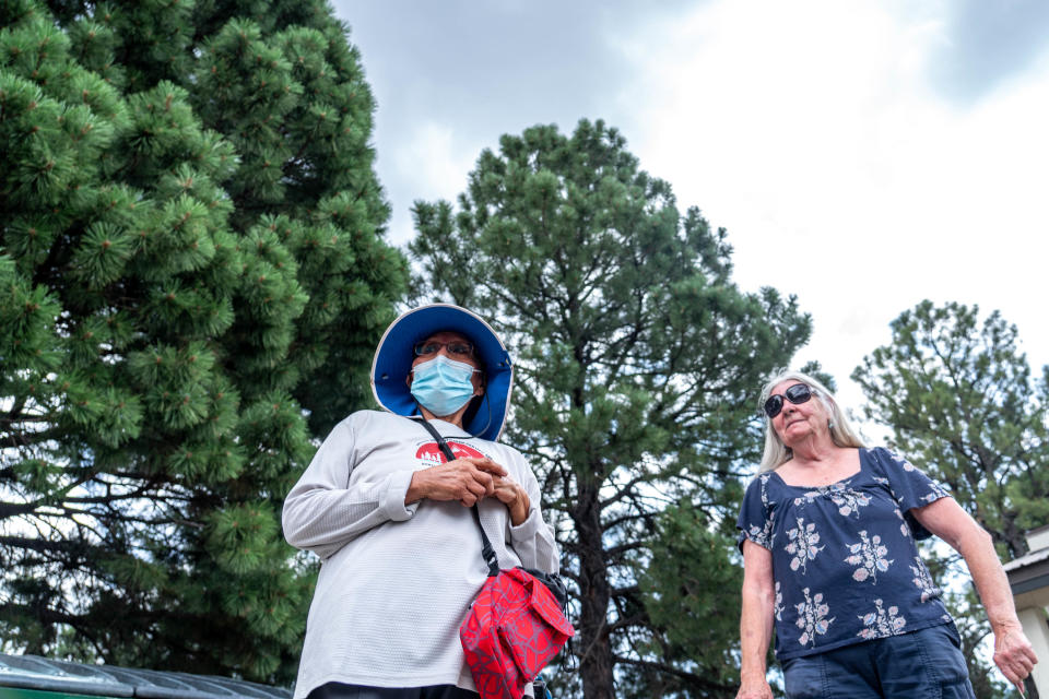 Karen Beeson, 69, left, diagnosed with cancer, and Wendy Petransky, 69, right, diagnosed with malignant melanoma but says it's currently not active, walk during a forest bathing session with the Arizona Cancer Support Community in Flagstaff on July 21, 2022. Shinrin-yoku, also known as forest bathing, is a Japanese health and wellness practice meant for participants to immerse themselves with the forest atmosphere.