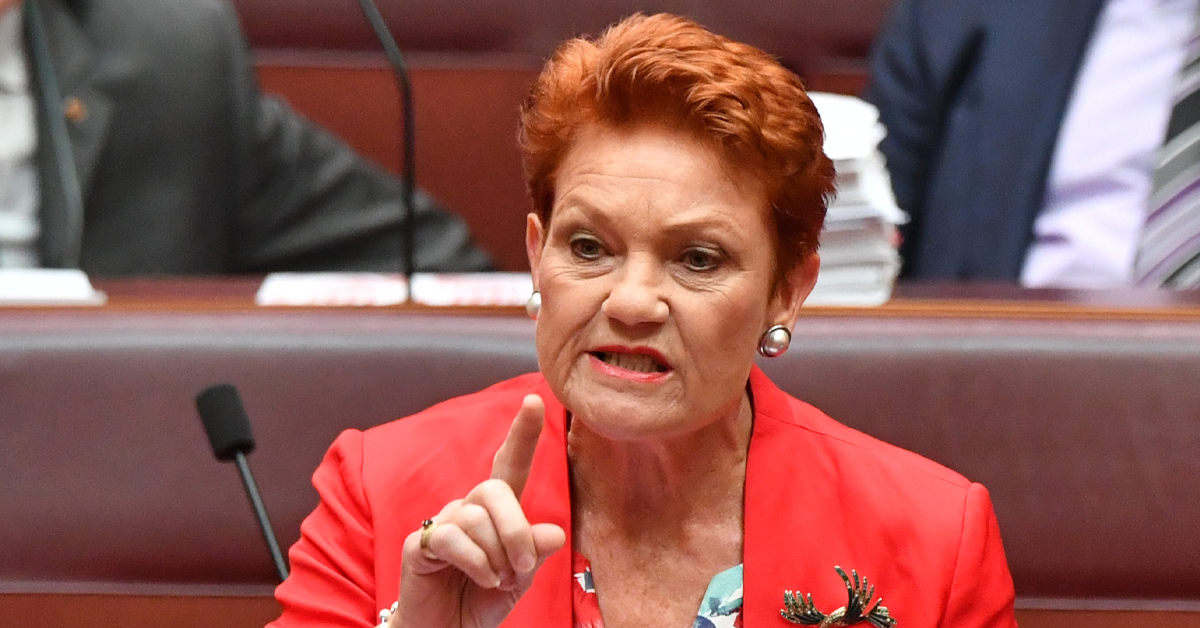 Pauline Hanson points a finger while speaking in parliament. 
