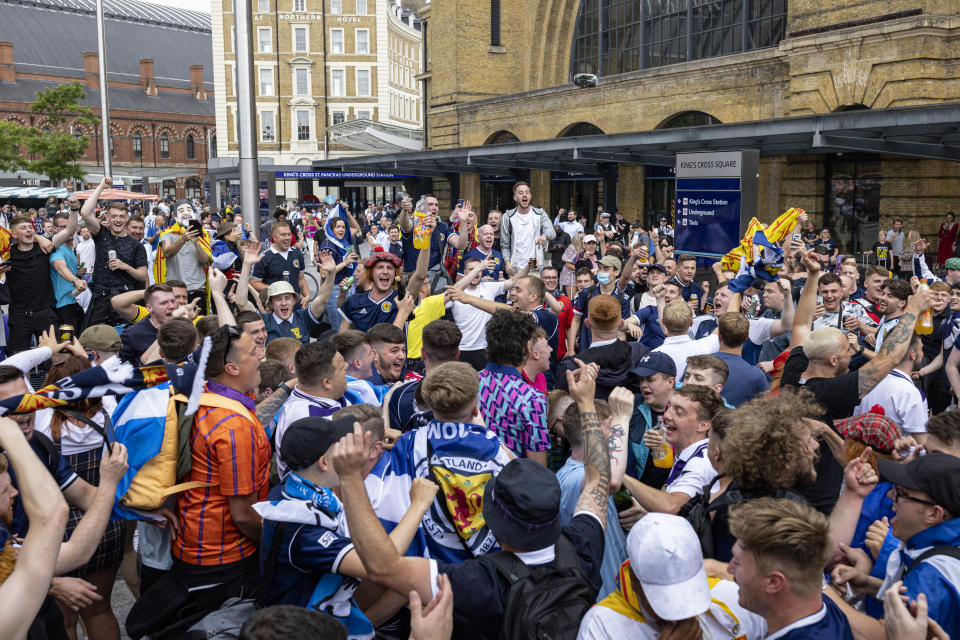 LONDON, ENGLAND - JUNE 17: Scotland fans chanting outside King's Cross Station on June 17, 2021 in London, England. Officials in Scotland and London, where the match will be hosted at Wembley Stadium, have discouraged Scottish fans without tickets to the game of coming south, due to concerns about the spread of Covid-19. (Photo by Rob Pinney/Getty Images)