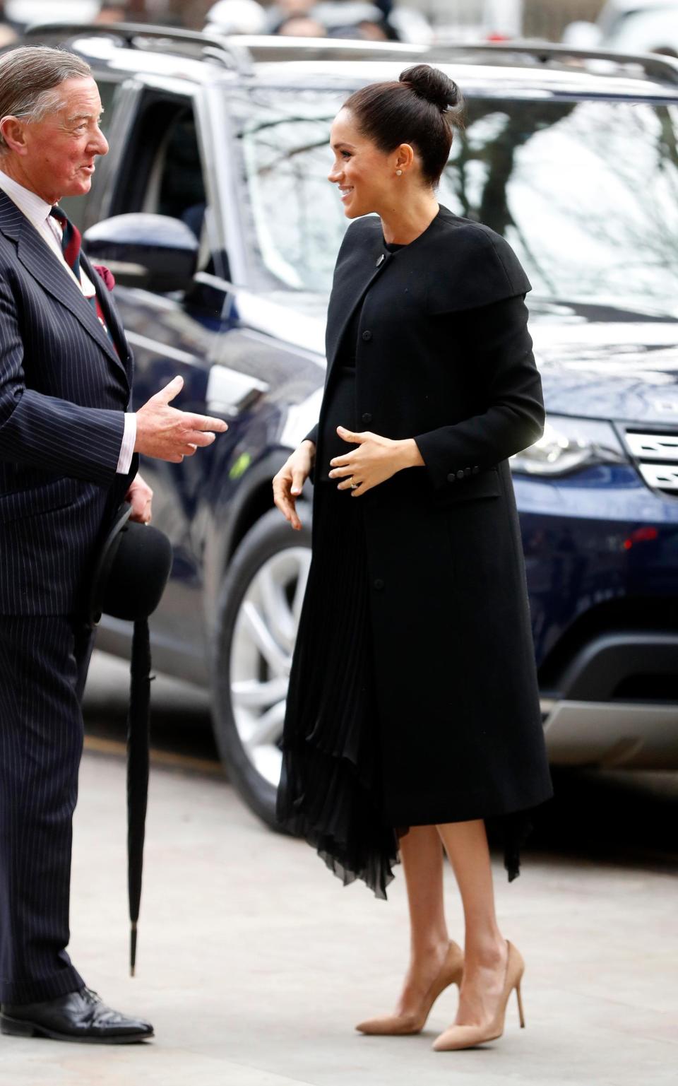 Meghan wearing heels while expecting her son Archie in 2019 - Getty