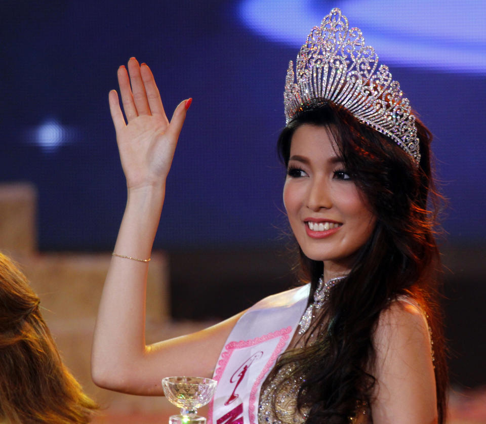 In this Thursday, Oct. 3, 2013 photo, Moe Set Wine poses for photos after she was crowned Miss Universe Myanmar at the National Theater in Yangon, Myanmar. Moe Set Wine will compete in the Miss Universe Contest in Moscow on Nov. 9. (AP Photo/Khin Maung Win)