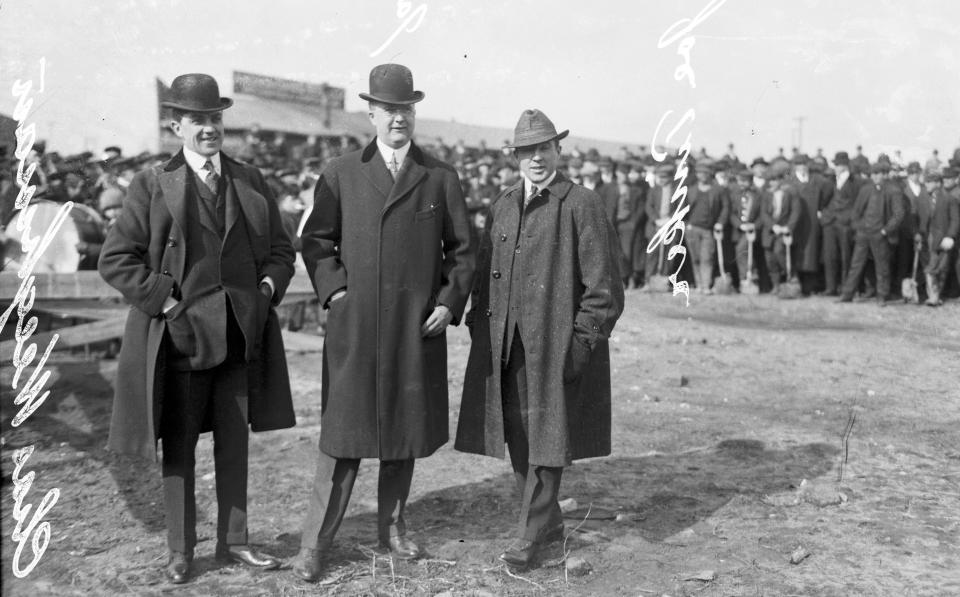 This 1914 photo provided by the Chicago History Museum shows, from left to right, Charles Weeghman, James Gilmore, and Federal League baseball player Joe Tinker (wearing street clothes), attending the groundbreaking of Weeghman Park in Chicago. Weeghman Park was renamed Wrigley Field in 1927. The famed ballpark will celebrate it's 100th anniversary on April 23, 2014. (AP Photo/Courtesy of the Chicago History Museum)