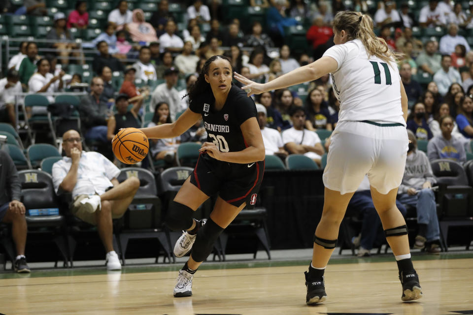 Stanford guard Haley Jones dribbles past Hawaii forward Kallin Spiller (11) during the third quarter of an NCAA college basketball game, Sunday, Nov. 27, 2022, in Honolulu. (AP Photo/Marco Garcia)