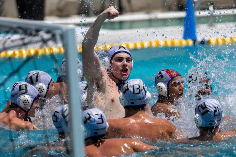 St. Thomas Aquinas players react to winning the 2023 Boy’s State Championship against he Wolverines at Belen Gian Zumpano Aquatic Center in Miami, Florida, on Saturday, April 15, 2023.