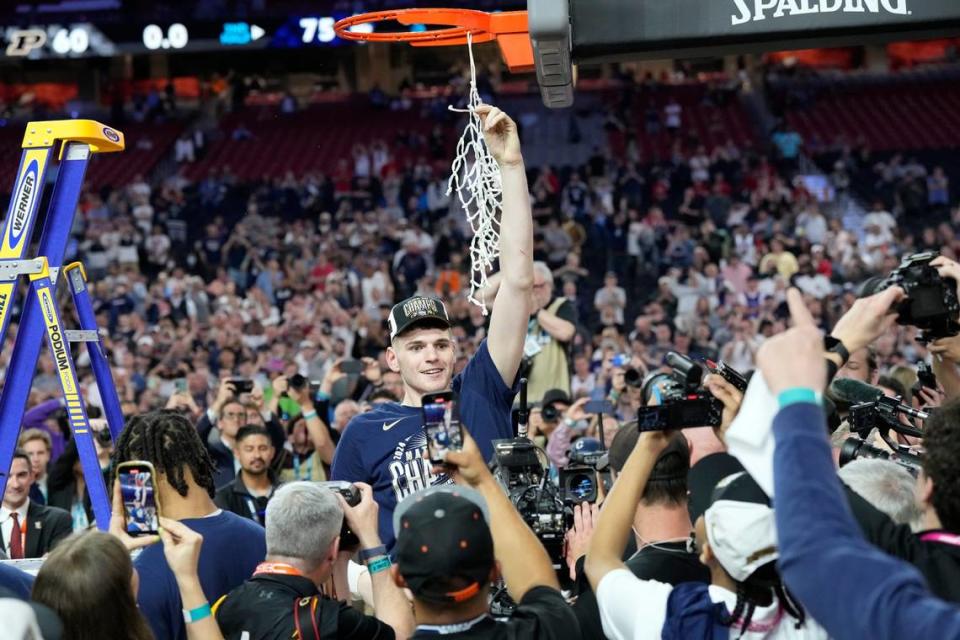 Connecticut Huskies center Donovan Clingan (32) celebrates winning the men’s NCAA national championship game against the Purdue Boilermakers on April 8, 2024, at State Farm Stadium in Glendale, Arizona.