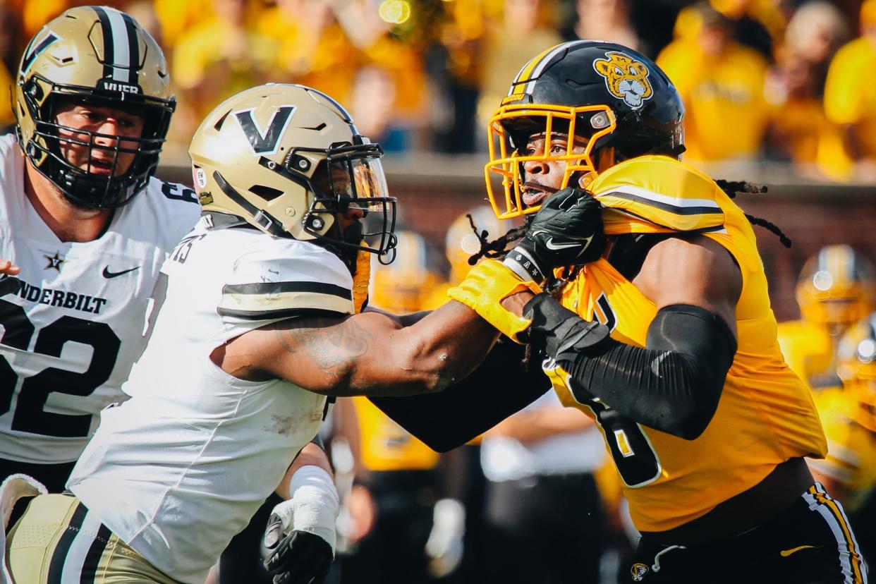 Tigers' defensive lineman Darius Robinson (6) gets held by a Commodore offensive lineman during Missouri's game against Vanderbilt at Faurot Field on Oct. 22, 2022.