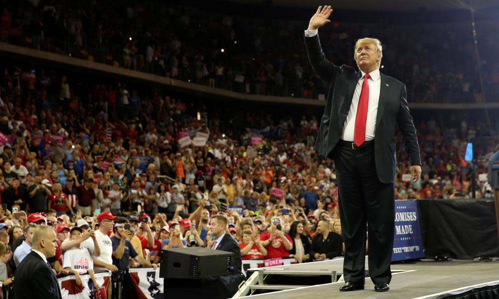 President Trump waves to the crowd in Duluth, Minnesota on Wednesday. During a speech he said outcry over child separations was a Democrat tactic.