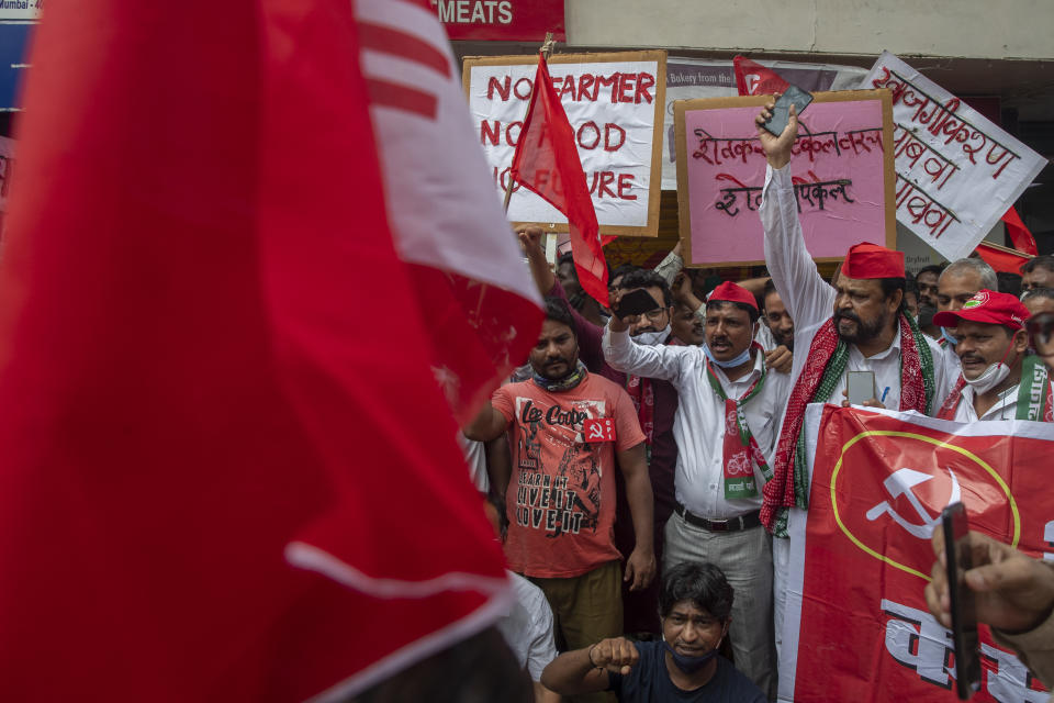 Members of Communist Party of India shout slogans during a protest against farm laws in Mumbai, India Monday, Sept. 27, 2021. The farmers called for a nation-wide strike Monday to mark one year since the legislation was passed, marking a return to protests that began over a year ago. (AP Photo/Rafiq Maqbool)