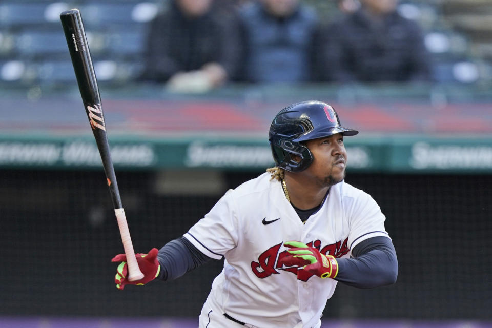 Cleveland Indians' Jose Ramirez watches his ball after hitting a solo home run in the fourth inning of a baseball game against the Chicago Cubs, Tuesday, May 11, 2021, in Cleveland. (AP Photo/Tony Dejak)