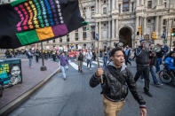 <p>Sam Marks waves a flag of diversity as he and the other protesters participate in march Monday, Feb. 20, 2017, in Philadelphia. Thousands of demonstrators turned out Monday across the U.S. to challenge Donald Trump in a Presidents Day protest dubbed Not My President’s Day. (Michael Bryant/The Philadelphia Inquirer via AP) </p>