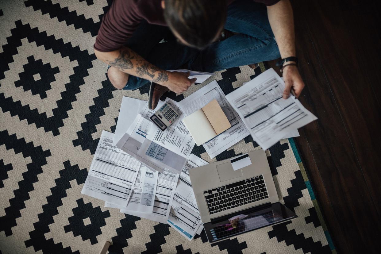 top view of a young man going through household finances