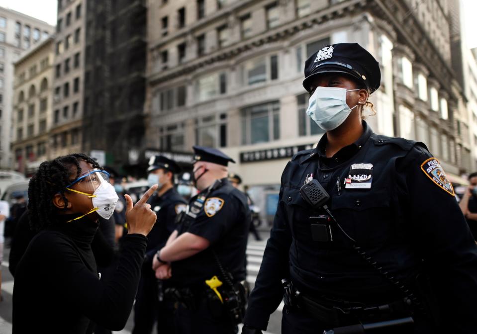 A protester confronts NYC police