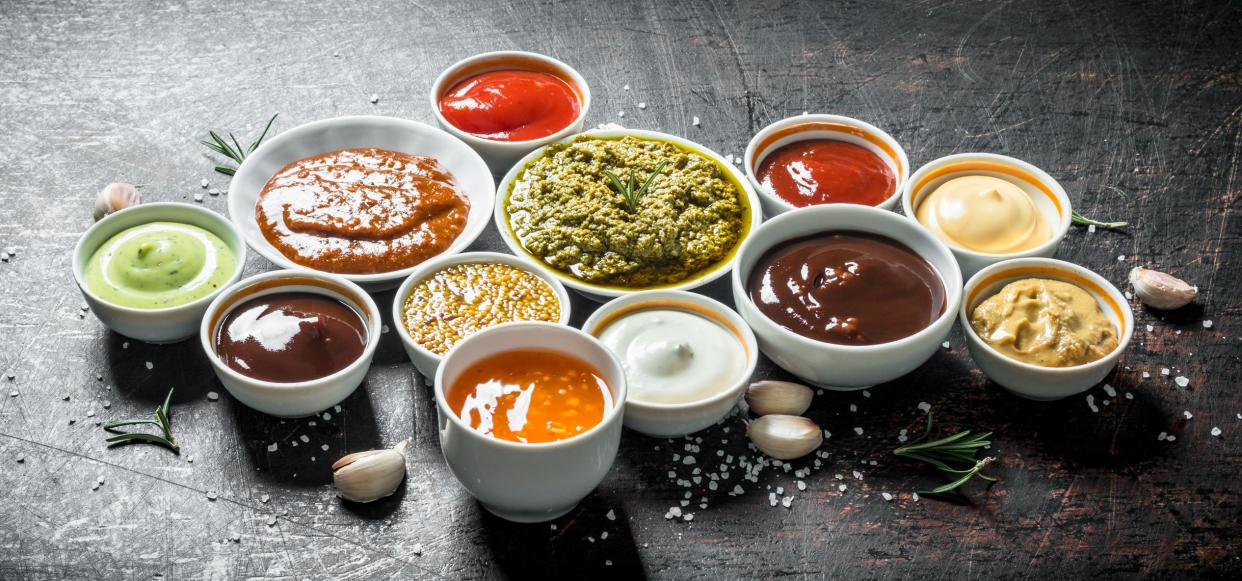 Mix from different kinds of sauces. On dark rustic background