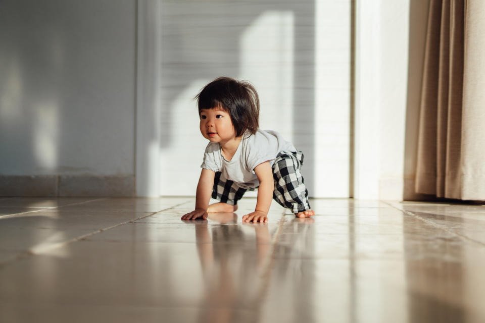 A baby getting up to walk