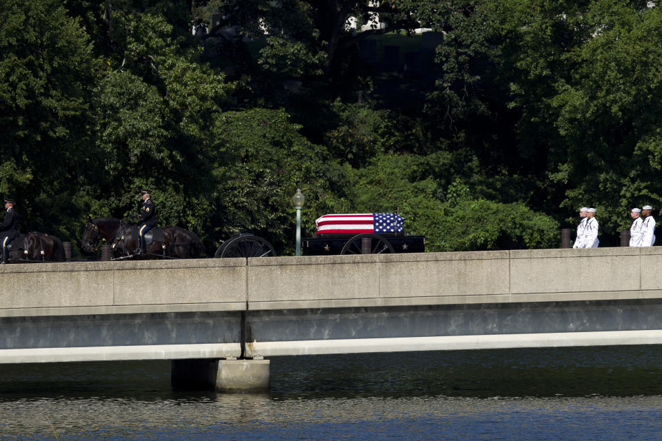 A horse drawn caisson carries the casket containing the remains of Sen. John McCain, R-Ariz., to his burial sight at the United States Naval Academy Cemetery in Annapolis Md., Sunday, Sep. 2, 2018. McCain died Aug. 25 from brain cancer at age 81. (AP Photo/Jose Luis Magana)