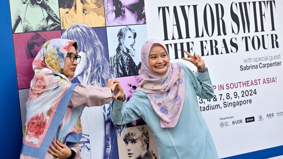 Taylor Swift's fans, or Swifties, pose for a picture at the National Stadium during Swift's Eras Tour concert in Singapore
