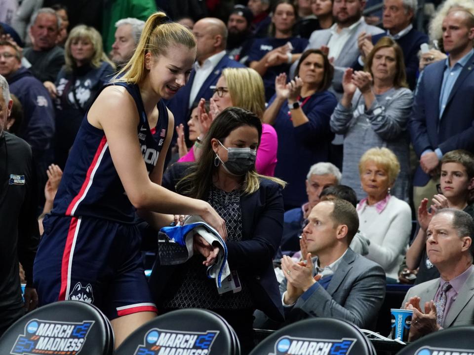 Dorka Juhasz holds an ice pack to her injured wrist.