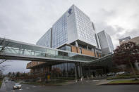 Providence Regional Medical Center Everett where a man with the first case of coronavirus in the United States is being treated on Tuesday, Jan. 21, 2020, in Everett, Wash. A U.S. resident who recently returned from a trip to central China has been diagnosed with the new virus. Health officials said Tuesday that the man returned to the Seattle area in the middle of last week after traveling to the Wuhan area, where the outbreak began. (Olivia Vanni/The Herald via AP)