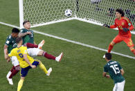 <p>Marcus Berg has a shot expertly tipped over by Guillermo Ochoa </p>